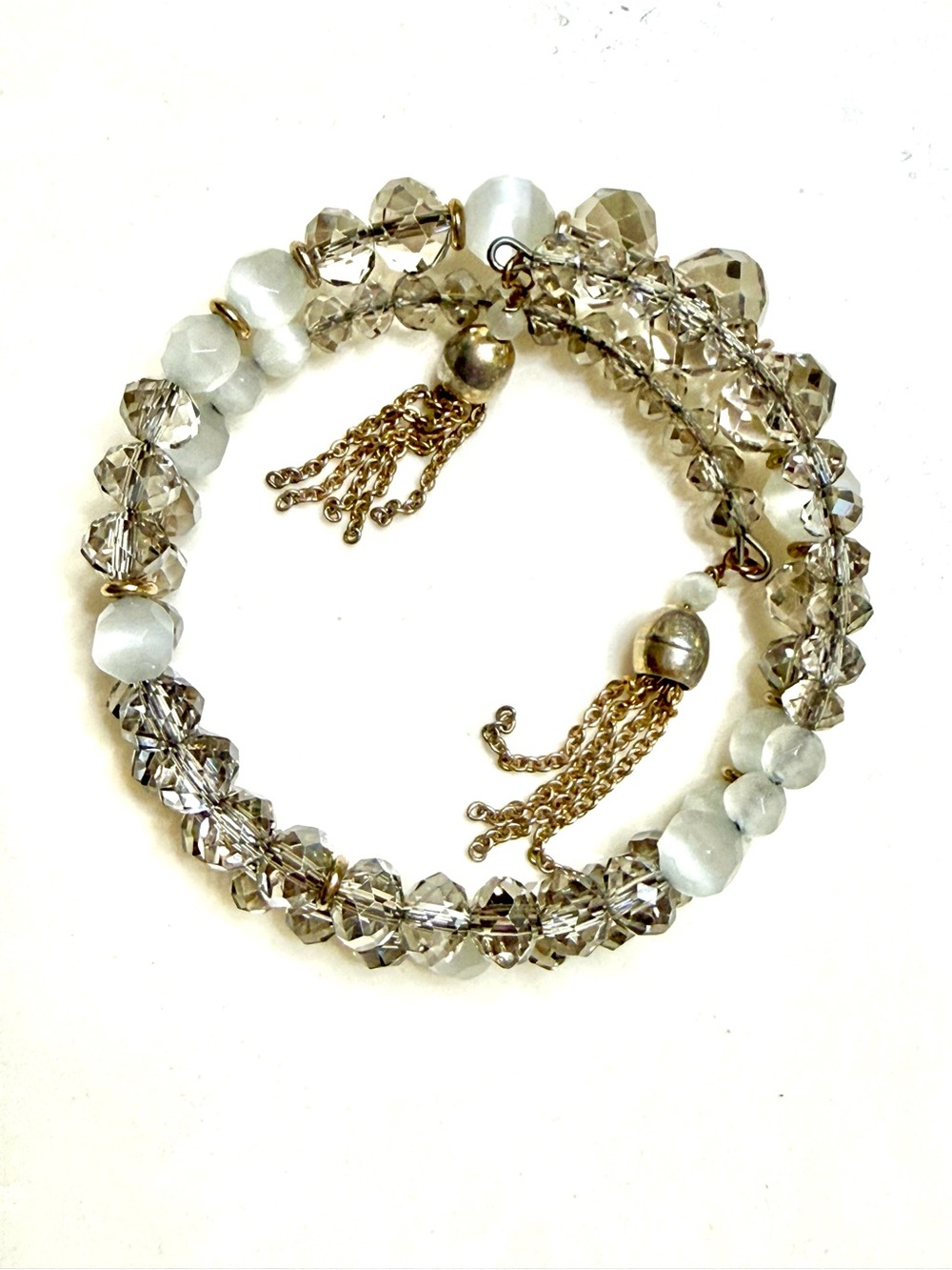 WHBM Crystal and White Bead Stretch Bracelet with Gold Tassels